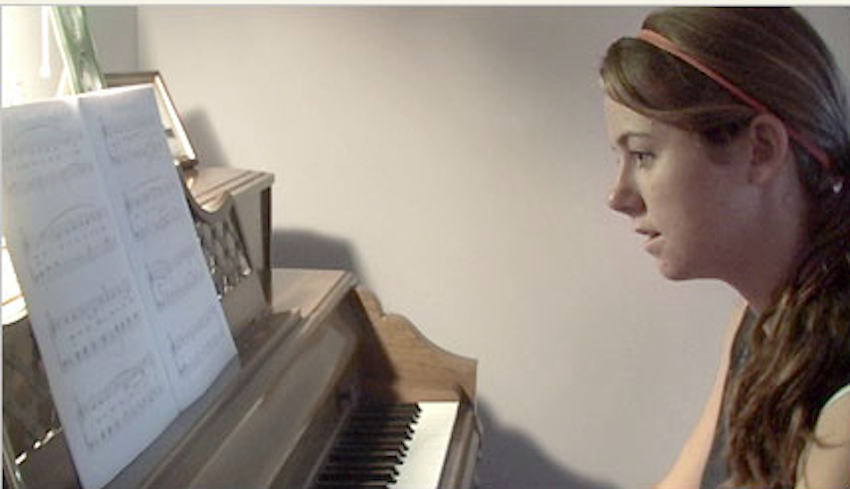 Young Woman Playing Piano