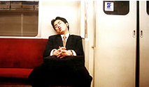 Picture of man sleeping on train