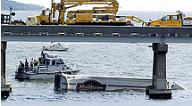 Photograph of Bay Bridge accident - Truck in water - Baltimore Sun photo by Colby E. Ware
