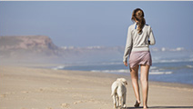 Woman Walking on Beach